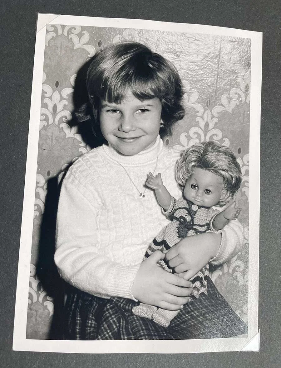 Little girl holding a doll